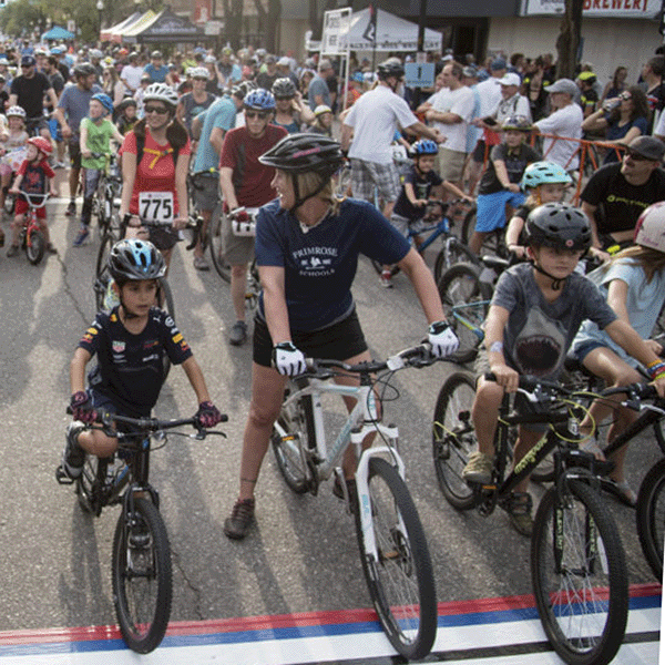Young riders at the starting line of the Littleton Twilight Criterium