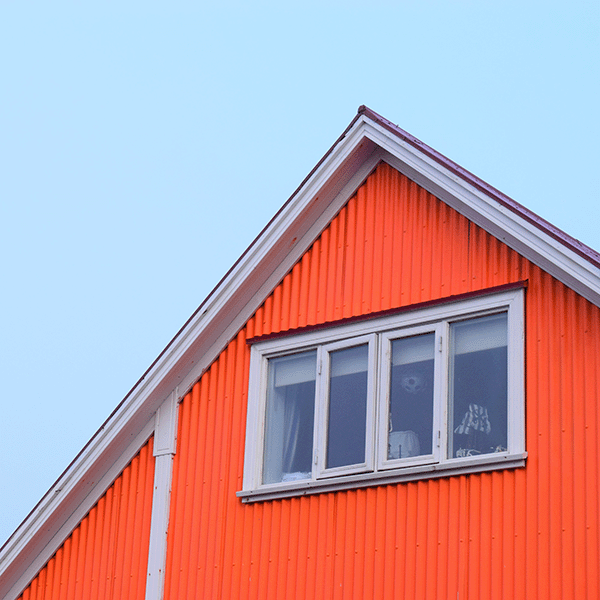 Attic window of red house